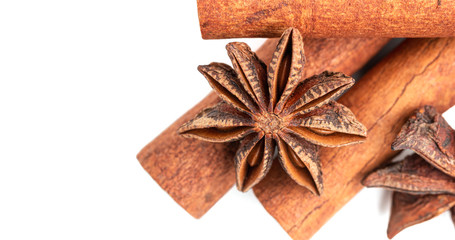 Star anise and cinnamon stick spice isolated on white background, top view