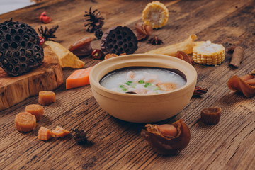 with mushrooms, scallions, shrimp, garlic, eggs, carrots to make a bowl of beauty porridge. 