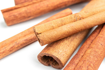 Cinnamon sticks isolated on white background, close-up view