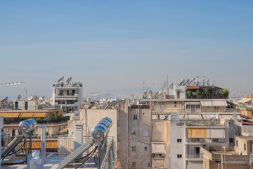 Fototapeta premium Athens, Greece - November 30 2019: Solar power battery cell of rooftops of the buildings in Athens