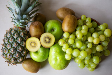 Pineapple, apple, pear, grapes, melon and Avocado