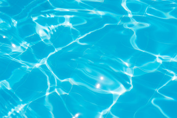 Glare from the sun on the water in the pool