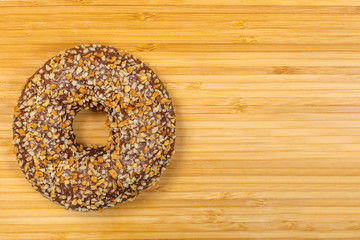 Glazed donut on a bamboo Board background
