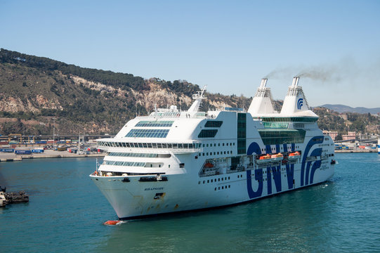 Barcelona, Spain - March 30, 2016: passenger ship GNV Rhapsody Genova in harbor. Cruise destination and trip on passenger ship. Summer vacation. Big passenger ship. Travelling by sea on passenger ship