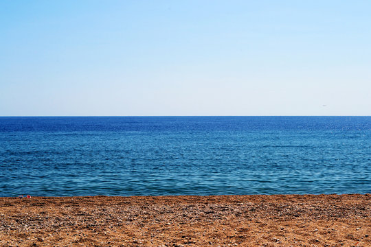 Background, gravel, blue sky and sea