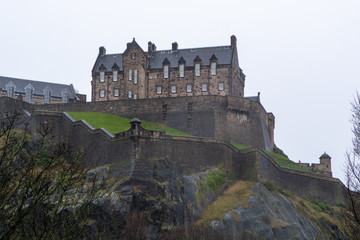 Fototapeta na wymiar View on Castle hill in old part of Edinburgh city, capital of Scotland, in rainy winter day.