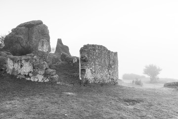 Landscape with old ruins a foggy day in the Barruecos Natural Park. Extremadura. Spain.