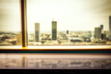 Desk of free space and window with city landscape 
