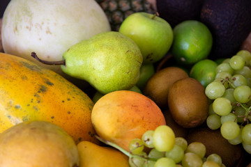 Pineapple, apple, pear, grapes, melon, honeymelon and Avocado