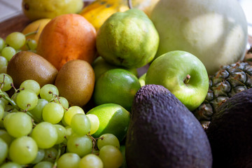 Pineapple, apple, pear, grapes, melon, honeymelon and Avocado