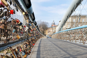 KRAKOW, POLAND - JANUARY 13, 2020: The Kladka Bernatka- bridge of love with love padlocks