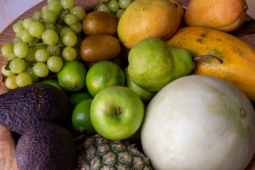 Pineapple, apple, pear, grapes, melon, honeymelon and Avocado