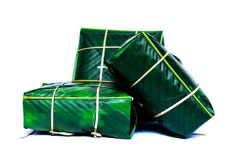 Studio shot three Chung Cakes (square sticky rice cake) Vietnamese New Year food isolated on white