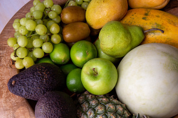Pineapple, apple, pear, grapes, melon, honeymelon and Avocado