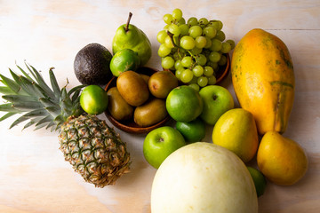 Pineapple, apple, pear, grapes, melon, honeymelon and Avocado