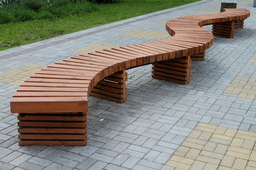 A curved wooden bench.