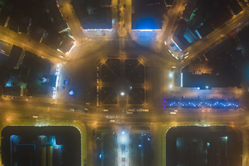 Night view of city center Kostroma with car traffic and illuminated Fire tower, Russia