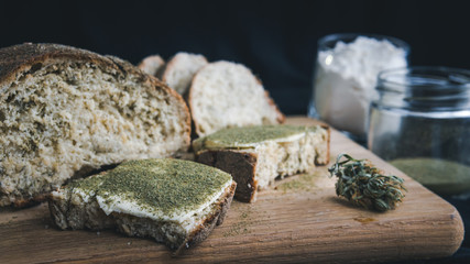 Close-up of bread with hemp flour, sandwich with cannabis butter and hashish