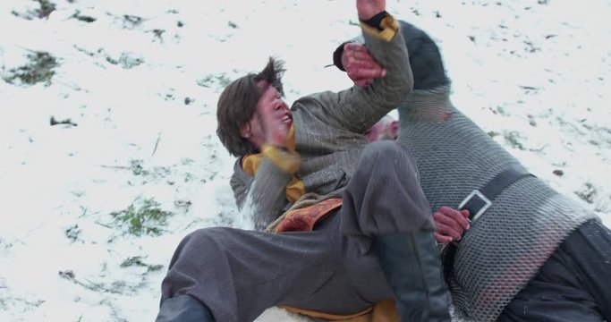 Strong historical fight between armed cossacks in cold snowy middle ages