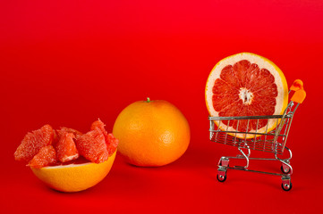 Grapefruit ripe and juicy and healthy, shot large on a red background