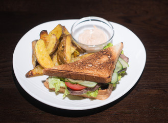 sandwich with beef and fried potatoes