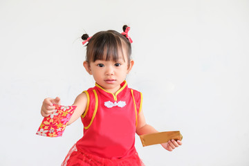 Chinese New Year festival concept, Portrait image of 1-2 yeas old baby. Happy Asian Chinese 's baby girl in the red clothes. She holding a pocket money gift in her hand. On white background.