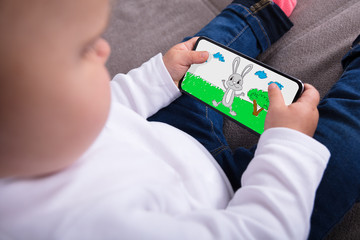 Baby Girl Watching Cartoon On Smartphone