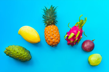 Still life, composition, set of fresh ripe tropical exotic fruits: orange pineapple, ananas, maracuya, yellow mango, dragon fruit, pitaya or pitahaya, passion fruit, guava,  sugar sweet apple, annona