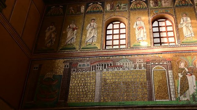 Ravenna, Italy, December 2019. Basilica of Sant'Apollinare Nuovo. Footage with slow pan movement on the detail of the mosaic of the port of Classe, from where the procession starts.