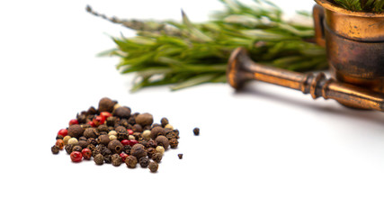 Fototapeta premium Composition of fragrant herbs-rosemary and thyme, black, pink and white pepper, copper mortar for seasonings, close-up, isolated on a white background. For menus, greetings, labels, and packaging.