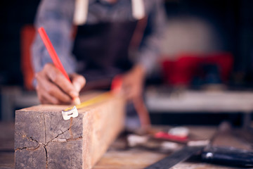 A carpenter is working on the construction site.