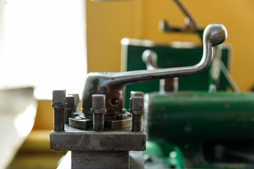 Fototapeta na wymiar spindle, tool holder and old green lathe machine tool equipment