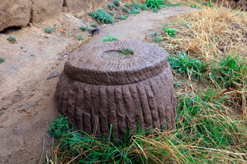Ancient stone tools were buried in the grass