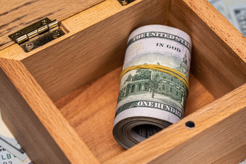 Dollar Bills in Wooden Box