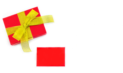 red gift with gold ribbon and red card for text