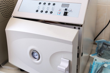 Autoclave with medical instruments in sterilization room in clinic