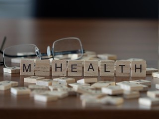 m health (mobile health) concept represented by wooden letter tiles