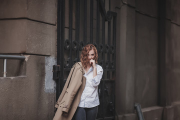 Fototapeta na wymiar trendy look charming woman in coat in street