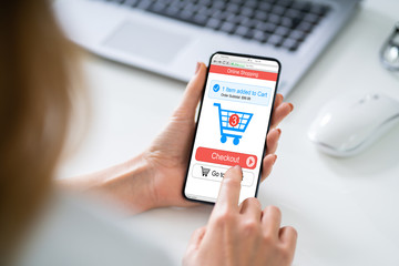 Mobile With Online Shopping Application On A Screen