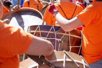 Music band playing a bass drum during an outdoor festival. Spanish culture