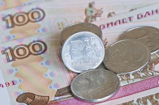 Money. Russian rubles coins and 100  rubles bills
