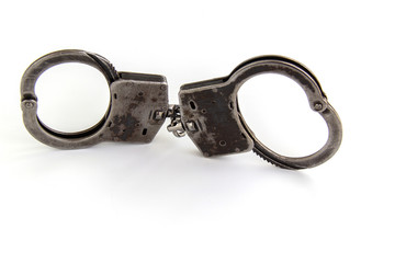 real police handcuffs isolated on white background