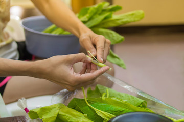 She prepares ingredients for cooking.