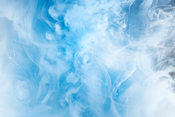 Abstract blue clear sky background with white soft clouds of smoke, lightness and weightlessness, watercolor pattern