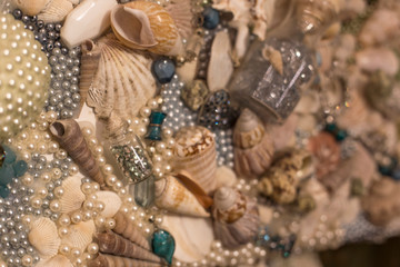 Fototapeta na wymiar decorations made from different shape and color seashells.