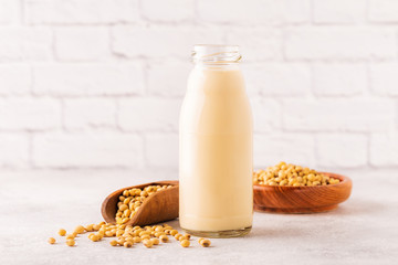 A bottle of soy milk and soy beans