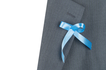 A blue awareness ribbon on the label of the jacket