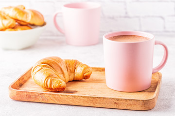 French croissants and cup of coffee.