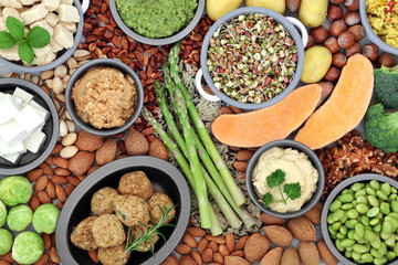 Vegan health food for ethical eating concept with tofu falafel balls, fruit, vegetables, nuts grains & seeds high in protein, vitamins, minerals, omega 3, antioxidants, smart carbs & fibre. Flat lay.
