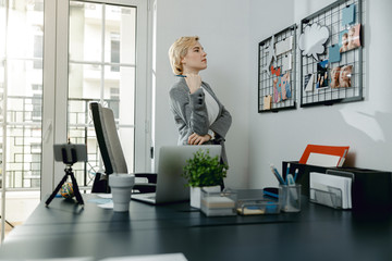 Pretty lady looking on mood board and dreaming